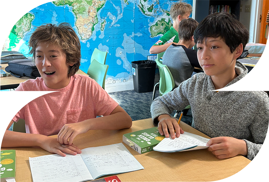 2 students with notebooks open